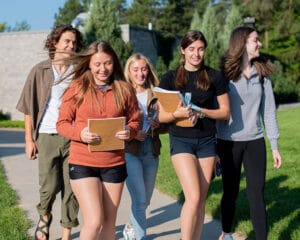 5 Students On Sidewalk